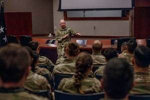 Military leaders speaks to members of his staff