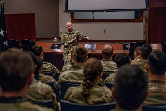 Military leaders speaks to members of his staff