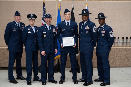 U.S. Air Force Chief of Staff Gen. Ken Wilsbach, third from left, poses for a photo with Airman 1st Class Lucas Estes, Basic Military Training top graduate, and leaders with the 737th Training Group at Joint Base San Antonio-Lackland, Texas, April 23, 2026. Estes earned top graduate honors upon completion of 7 1/2 weeks of Basic Military Training.