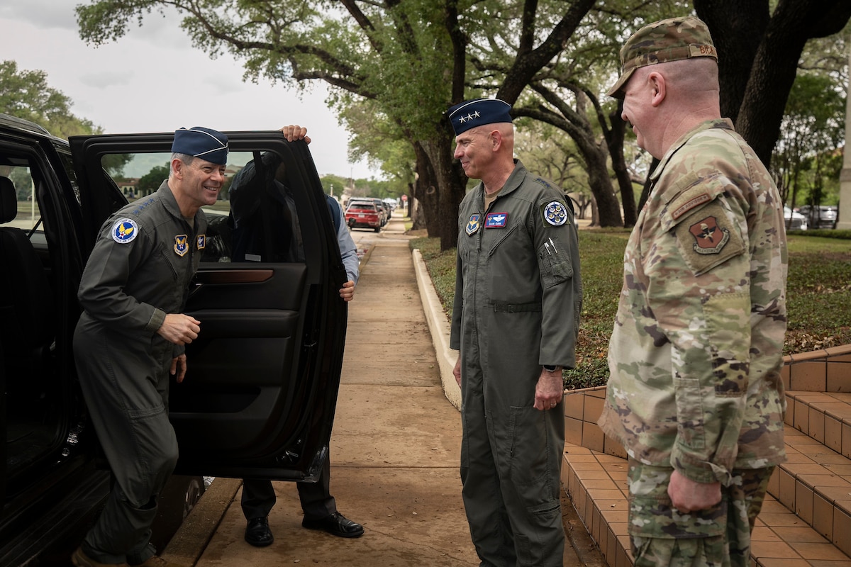 U.S. Air Force Chief of Staff Gen. Ken Wilsbach is greeted by Lt. Gen. Clark Quinn, commander of Air Education and Training Command, and Chief Master Sgt. Chad Bickley, AETC command chief at Joint Base San Antonio-Randolph, Texas, April 23, 2026. Wilsbach and his wife, Mrs. Cindy Wilsbach, visited several organizations within JBSA for a comprehensive immersion into The First Command.