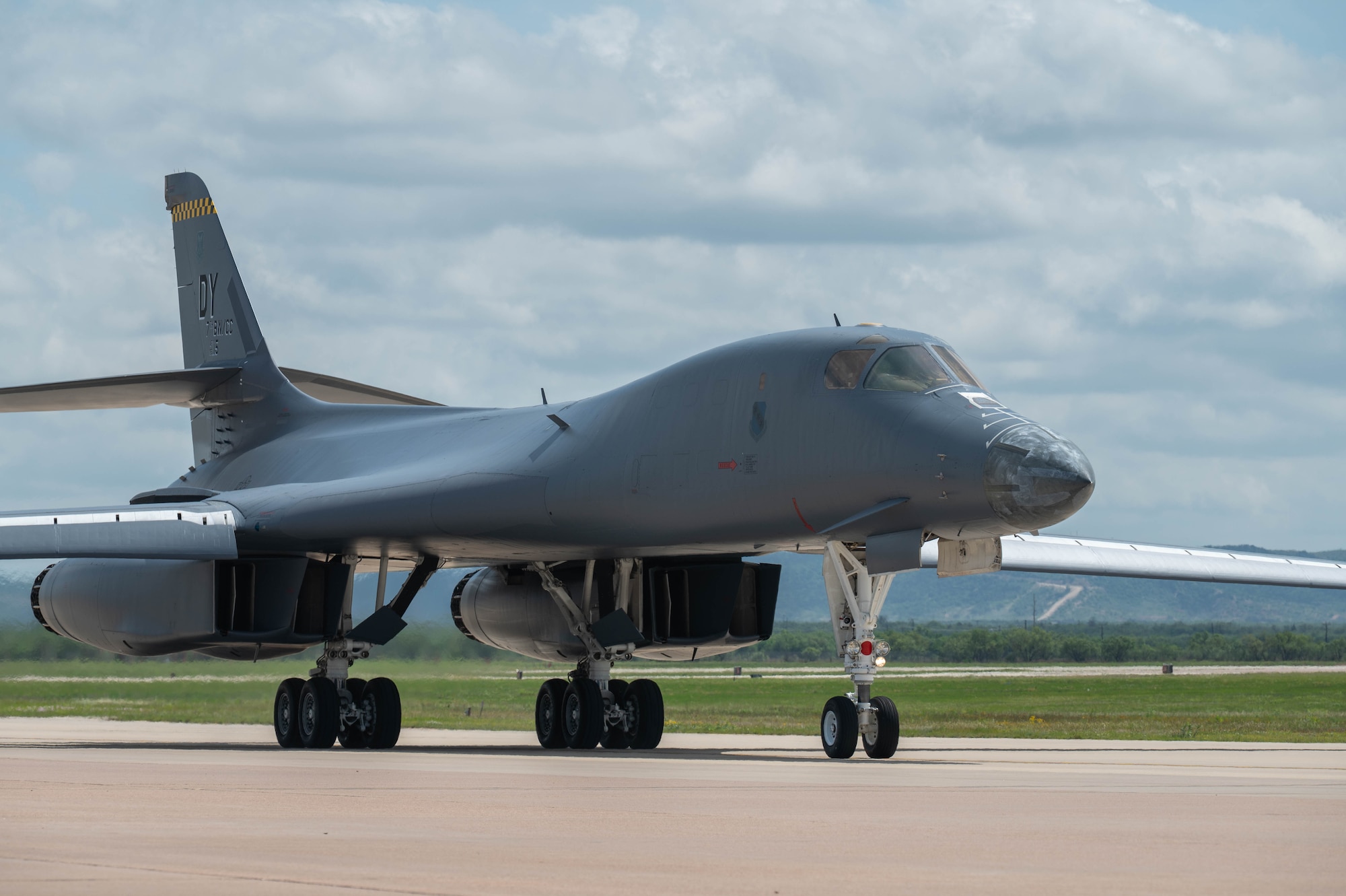 A B-1B Lancer, tail number 86-0115, taxis across the flightline at Dyess Air Force Base, Texas, April 22, 2026. Recalled from long-term storage and regenerated to maintain the Air Force's operational fleet, the bomber was designated as the 7th Bomb Wing's new flagship and named “Apocalypse II” to honor a fallen World War II B-24J Liberator crew. (U.S. Air Force photo by Airman 1st Class William Neal)