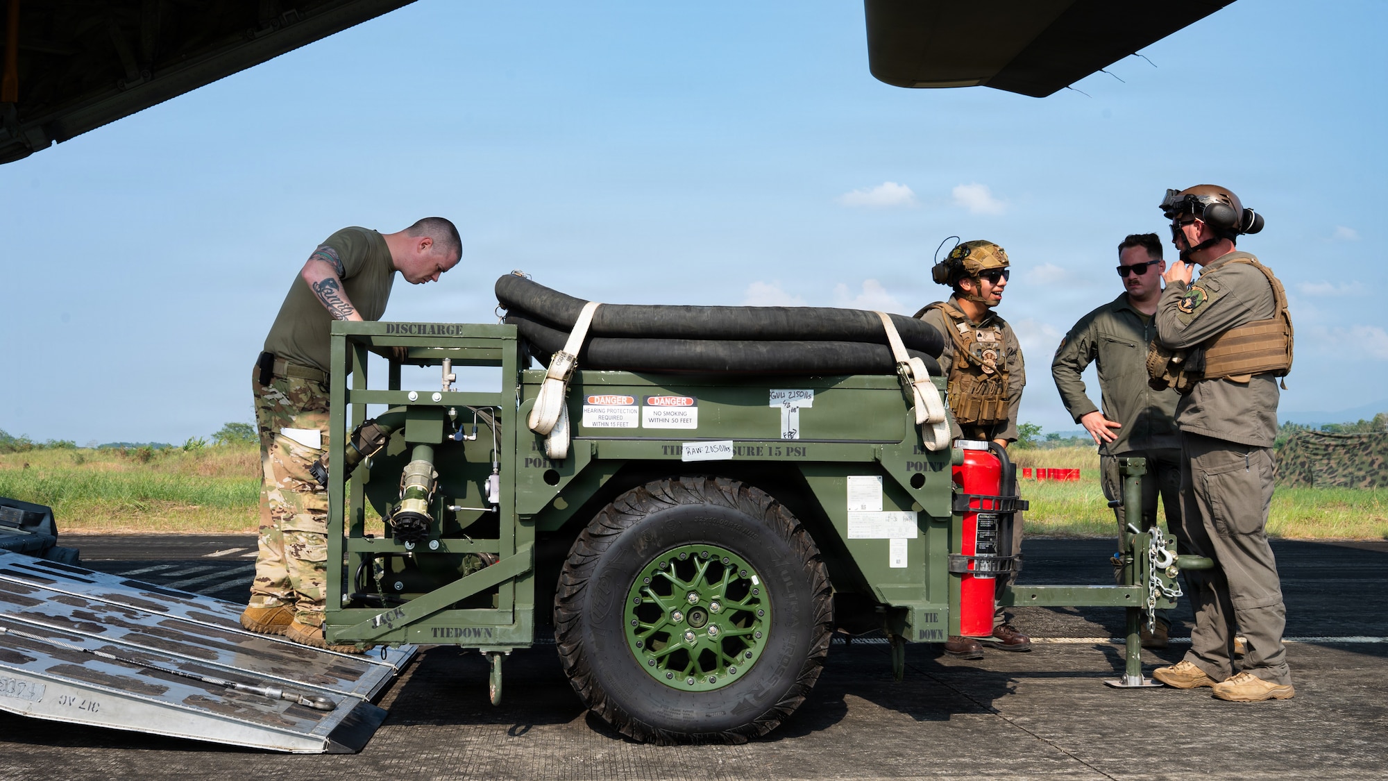 Airmen fly in a C-130J