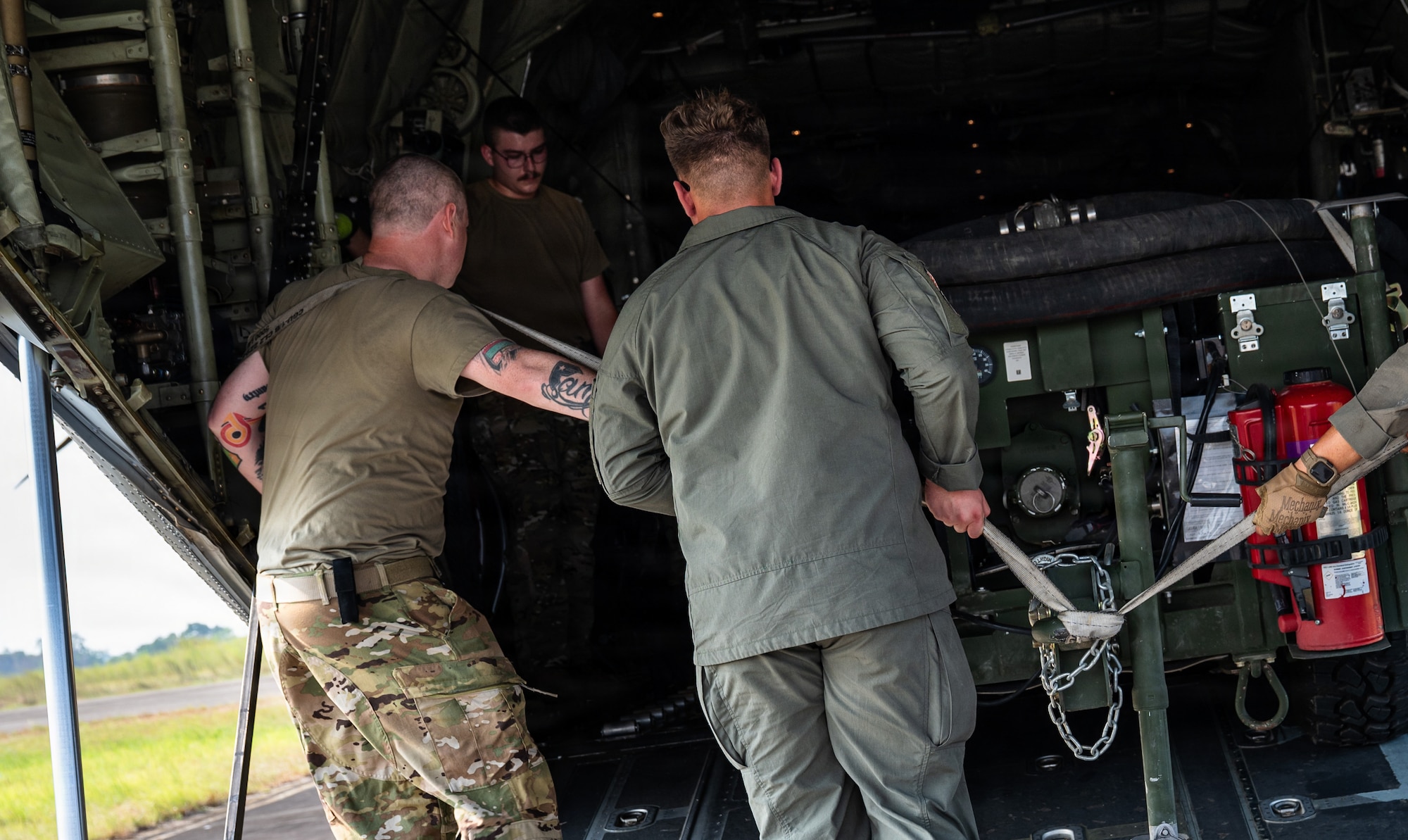 Airmen fly in a C-130J