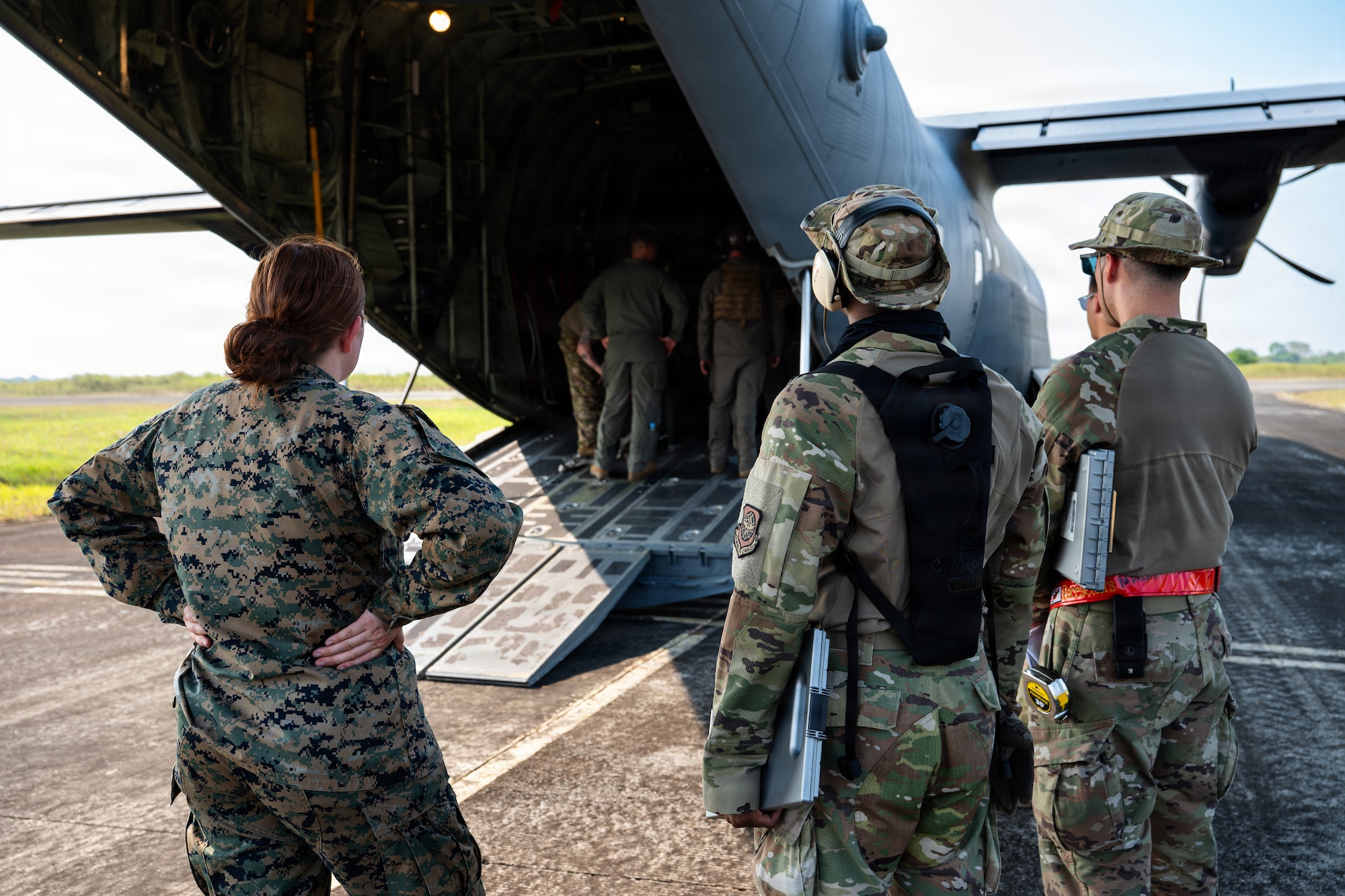 Airmen fly in a C-130J