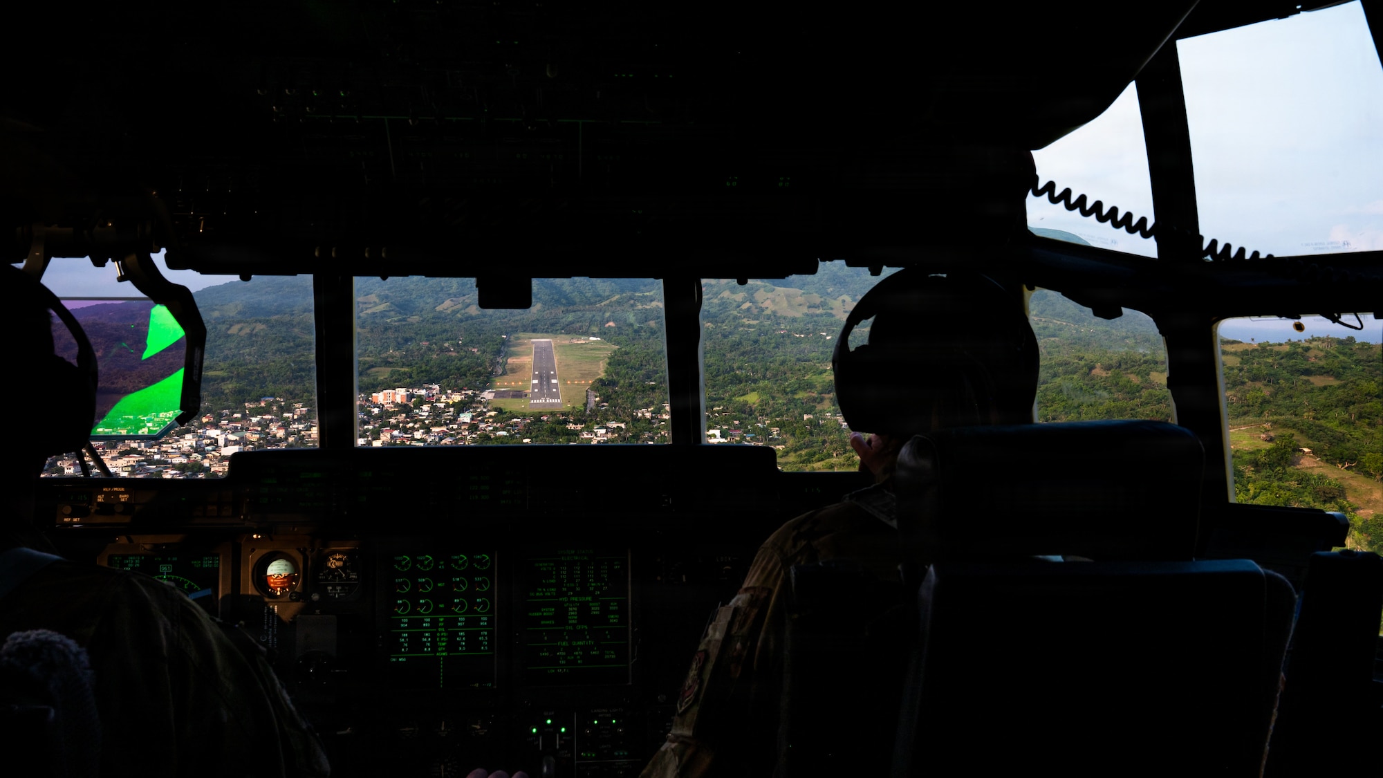 Airmen fly in a C-130J
