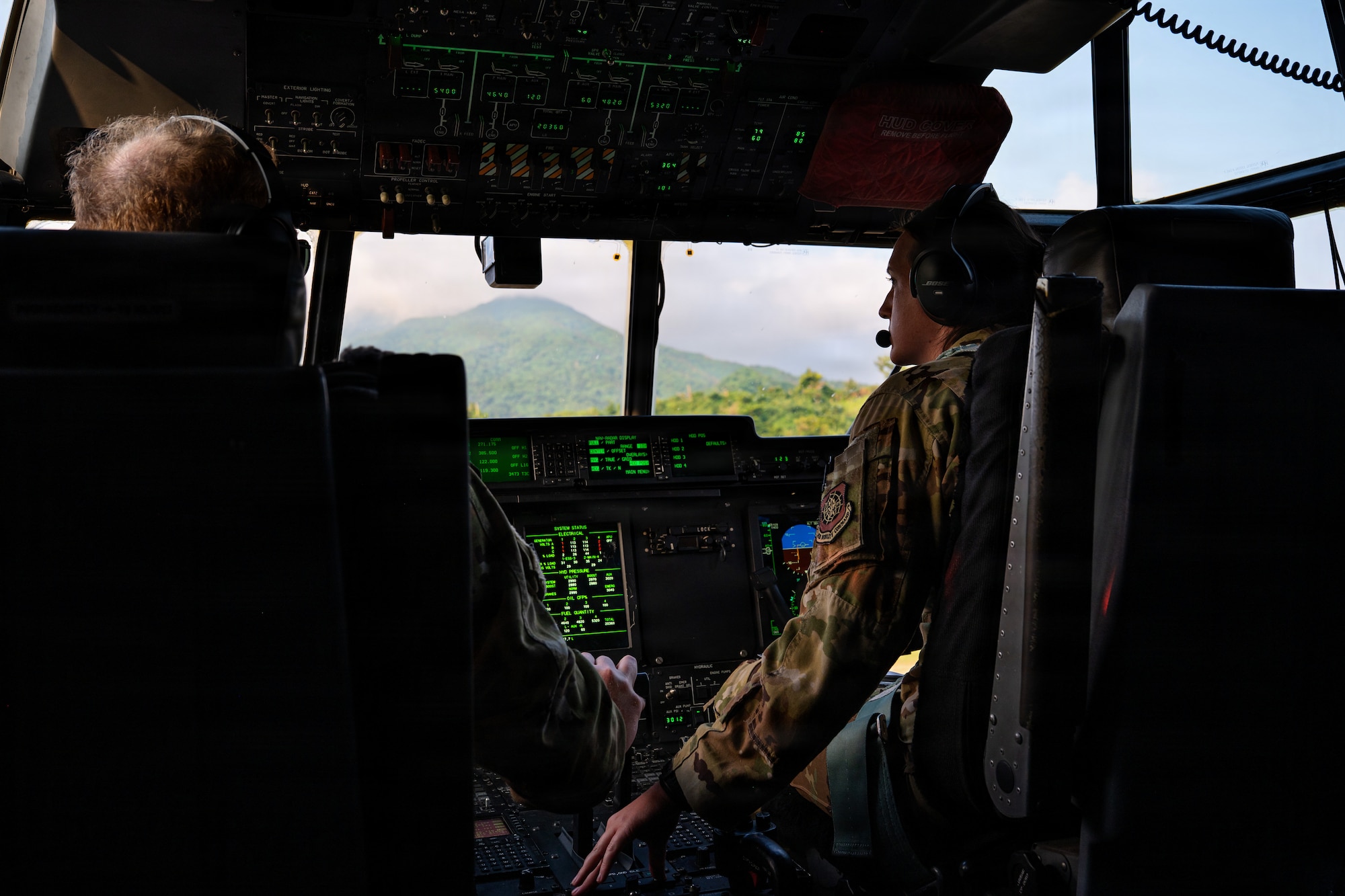 Airmen fly in a C-130J