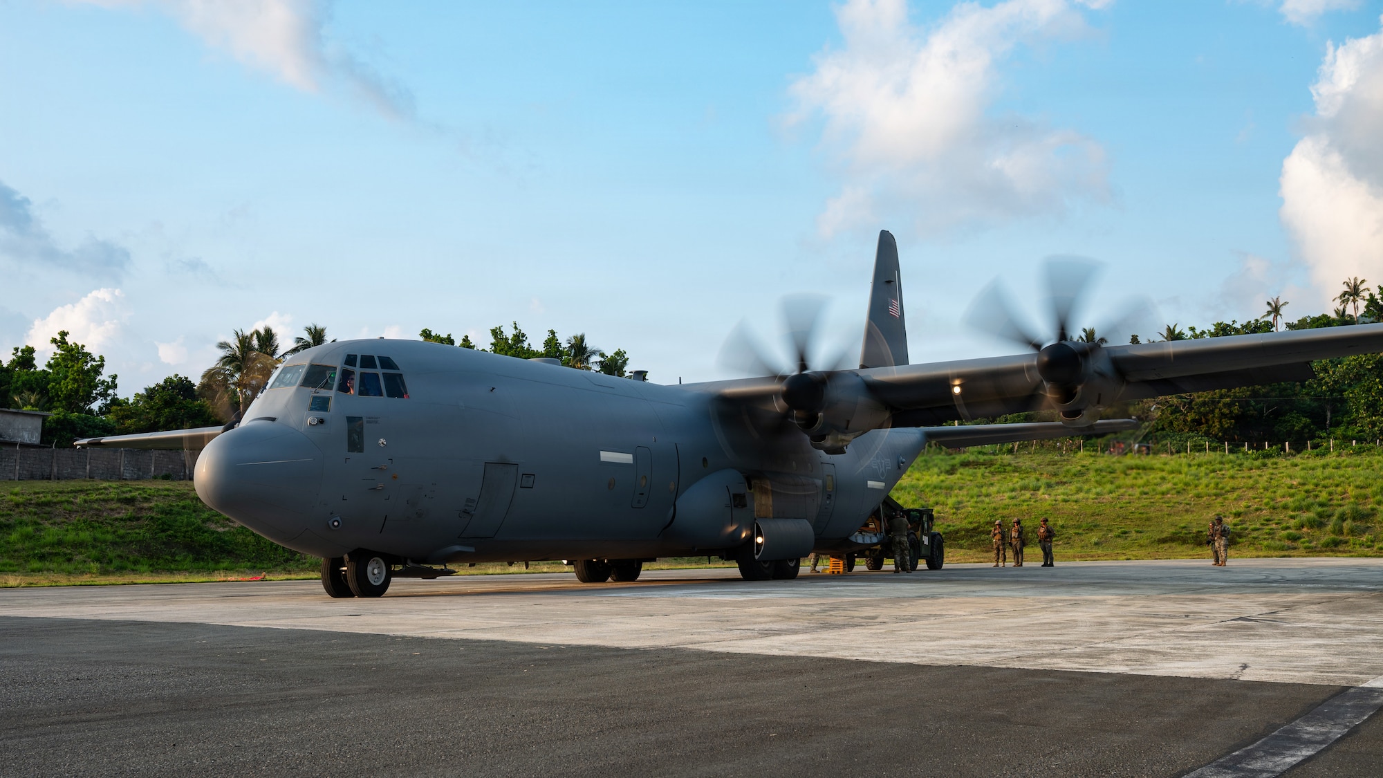 Airmen fly in a C-130J