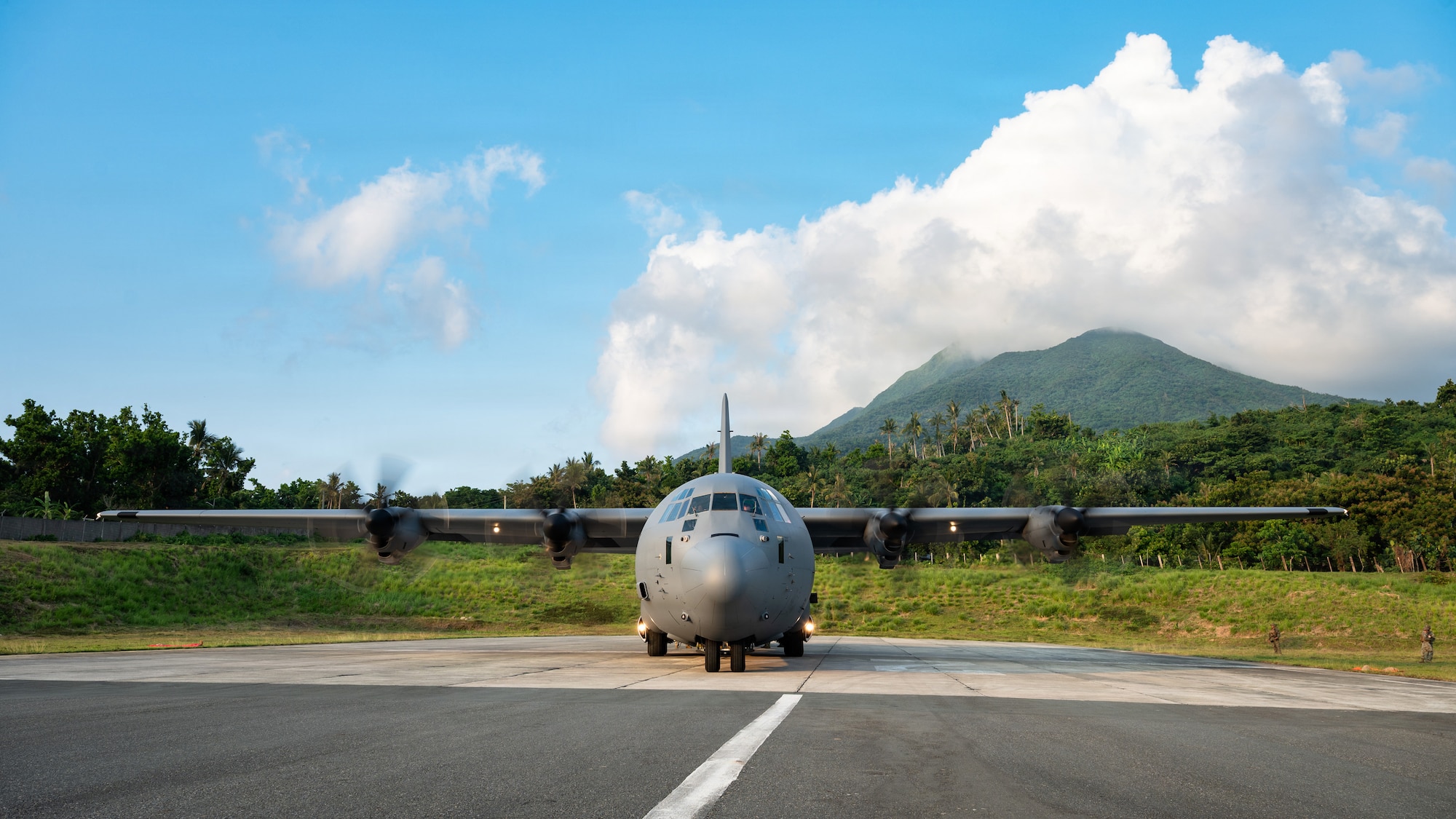 Airmen fly in a C-130J