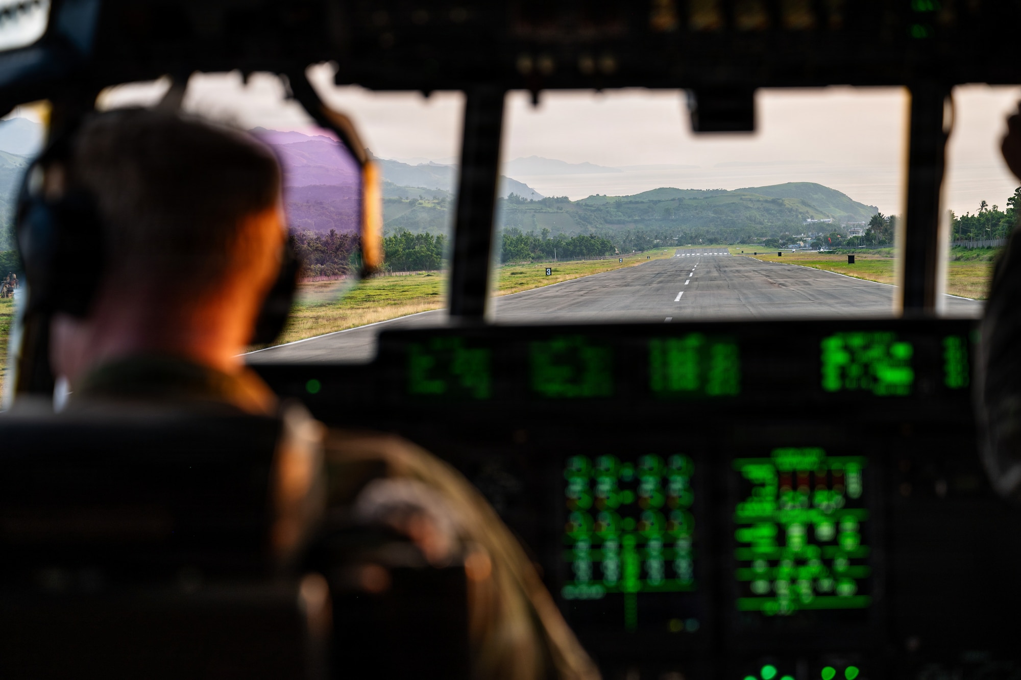 Airmen fly in a C-130J
