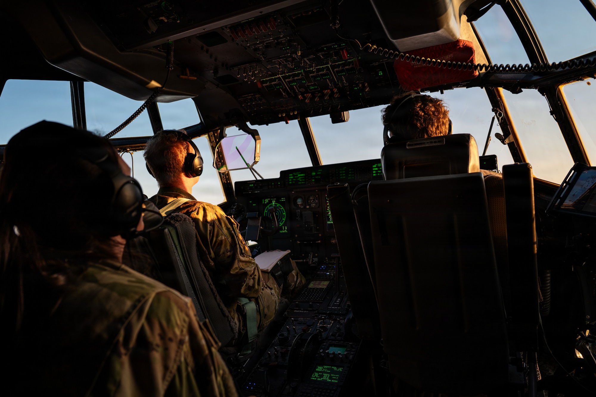 Airmen fly in a C-130J
