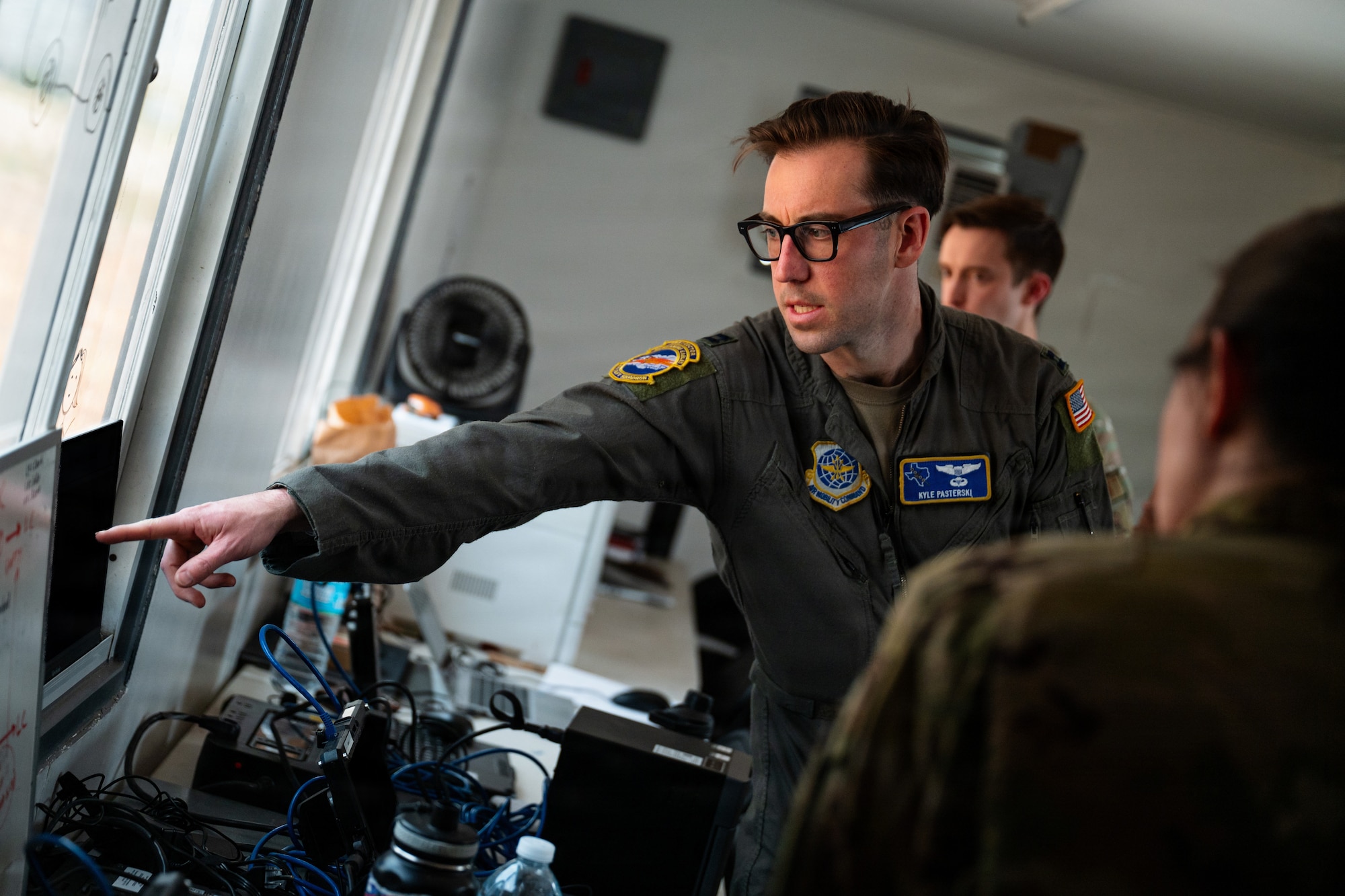 Airmen work on a C-130J