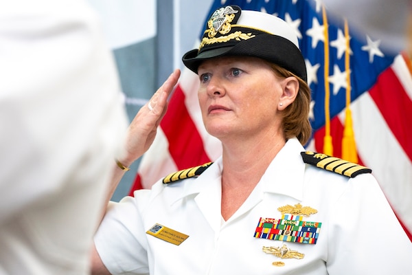 Military officer in whites salutes