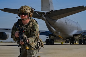 A U.S. Airman assigned to the 31st Combat Air Base Squadron provides security for a KC-135 Stratotanker assigned to the 909th Aerial Refueling Squadron during exercise Freedom Flag 26-1 at Kunsan Air Base, Republic of Korea, April 16, 2026. Freedom Flag 26-1 is a routine, defensive training event designed to prepare forces for tactical execution of combat missions. (U.S. Air Force photo by Senior Airman Ty Pilgrim)