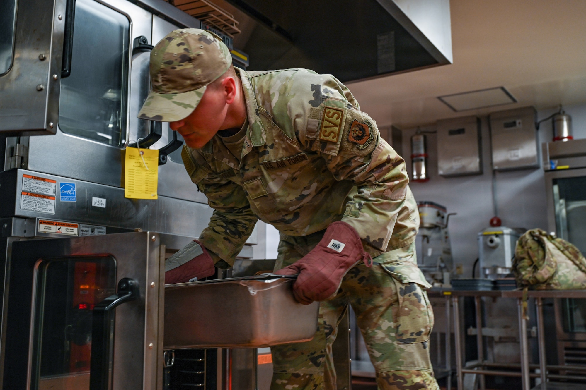 A U.S. Airman assigned to the 31st Combat Air Base Squadron prepares food for designated forces during exercise Freedom Flag 26-1 at Gwangju Air Base, Republic of Korea, April 9, 2026. Throughout the joint, combined training event, 31 CABS demonstrated its ability to provide critical sustainment, including water and food services. (U.S. Air Force photo by Senior Airman Ty Pilgrim)