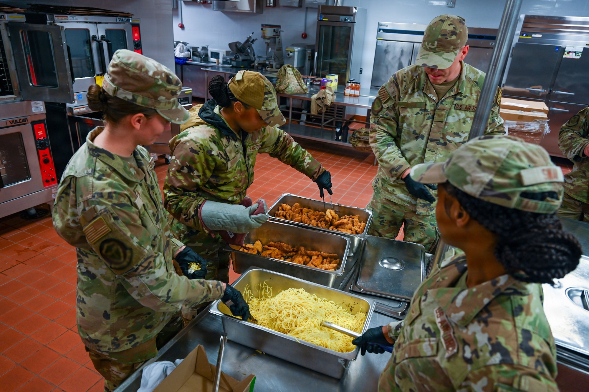 U.S. Airmen assigned to the 31st Combat Air Base Squadron prepare food for designated forces participating in exercise Freedom Flag 26-1 at Gwangju Air Base, Republic of Korea, April 9, 2026. Throughout the joint, combined training event, 31 CABS demonstrated its ability to provide critical sustainment, including water and food services. (U.S. Air Force photo by Senior Airman Ty Pilgrim)
