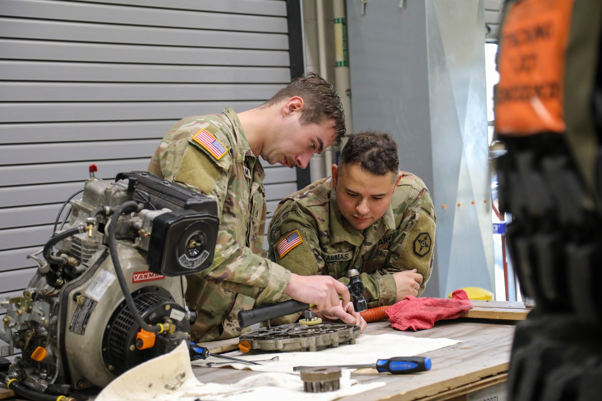 U.S. Army Reserve Spc. Joseph Dearmas and Pfc. Bille Buttram, 477th Inland Cargo Transportation Company, 385th Transportation Terminal Battalion, 364th Expeditionary Sustainment Command Soldiers, perform pre-deployment maintenance on a self-powered multifuel heater engine to ensure equipment readiness prior to forward positioning in the Indo-Pacific region, Dec. 19, 2025. The 364th Expeditionary Sustainment Command is headquartered in Marysville, Washington, and is regionally aligned to U.S. Indo-Pacific Command, providing logistical and sustainment support across seven western states and the Indo-Pacific region. (U.S. Army Photo by Maj. India Hunter)
