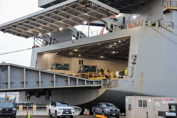 A U.S. Army Reserve M1083 Medium Tactical Vehicle with trailer carrying fuel tanks, assigned to the 477th Inland Cargo Transportation Company, 385th Transportation Terminal Battalion, 364th Expeditionary Sustainment Command, is driven aboard the MV Cape Horn (T-AKR-5068) at the Port of Tacoma, Washington, as part of forward positioning efforts in the Indo-Pacific region, Feb. 4, 2026. The 364th Expeditionary Sustainment Command is headquartered in Marysville, Washington, and is regionally aligned to U.S. Indo-Pacific Command, providing logistical and sustainment support across seven western states and the Indo-Pacific region. (U.S. Army Photo by Maj. India Hunter)