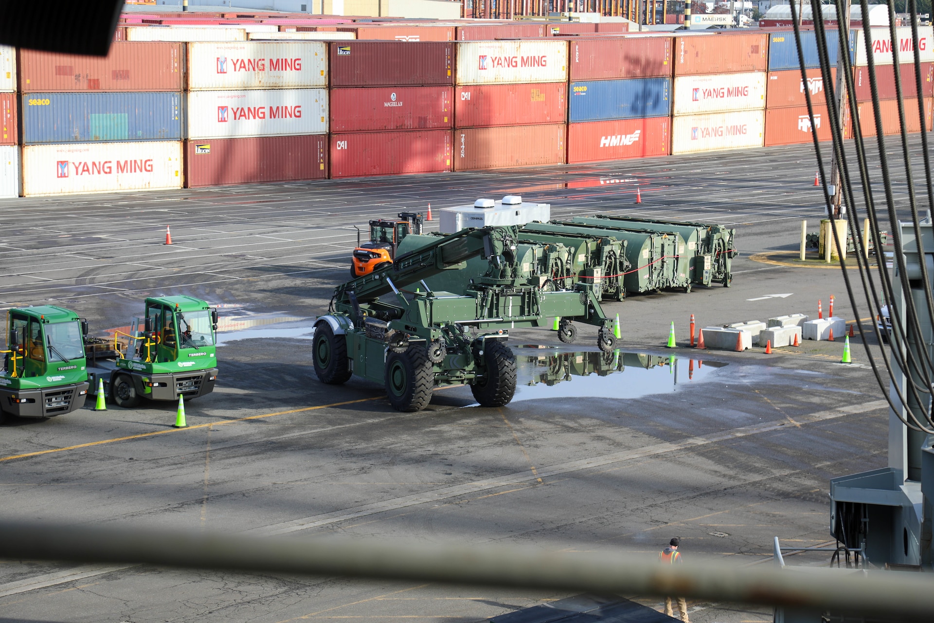 A U.S. Army Reserve Kalmar TRA240 Rough Terrain Container Handler assigned to the 477th Inland Cargo Transportation Company, 385th Transportation Terminal Battalion, 364th Expeditionary Sustainment Command, is prepared for loading aboard the MV Cape Horn (T-AKR-5068) at the Port of Tacoma, Washington, as part of forward positioning efforts in the Indo-Pacific region, Feb. 4, 2026. The 364th Expeditionary Sustainment Command is headquartered in Marysville, Washington, and is regionally aligned to U.S. Indo-Pacific Command, providing logistical and sustainment support across seven western states and the Indo-Pacific region. (U.S. Army Photo by Maj. India Hunter)