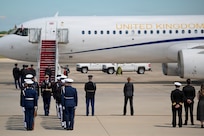 U.S. service members await the arrival of Their Majesties of the United Kingdom of Great Britain and Northern Ireland.