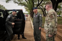U.S. Air Force Chief of Staff Gen. Ken Wilsbach is greeted by Lt. Gen. Clark Quinn, commander of Air Education and Training Command, and Chief Master Sgt. Chad Bickley, AETC command chief at Joint Base San Antonio-Randolph, Texas, April 23, 2026. Wilsbach and his wife, Mrs. Cindy Wilsbach, visited several organizations within JBSA for a comprehensive immersion into The First Command.