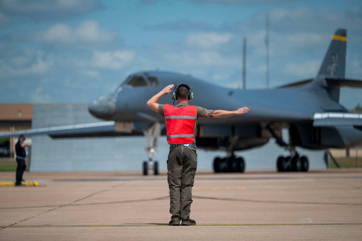 U.S. Air Force Airman 1st Class Trevor Francisco, 28th Bomber Generation Squadron assistant dedicated crew chief, taxis in a B-1B Lancer, tail number 86-0115, at Dyess Air Force Base, Texas, April 22, 2026. Francisco is part of the maintenance team responsible for keeping the newly regenerated bomber mission-ready after it was recalled from retirement to support the active bomber fleet and serve as the 7th Bomb Wing's historic "Apocalypse II" flagship. (U.S. Air Force photo by Airman 1st Class William Neal)