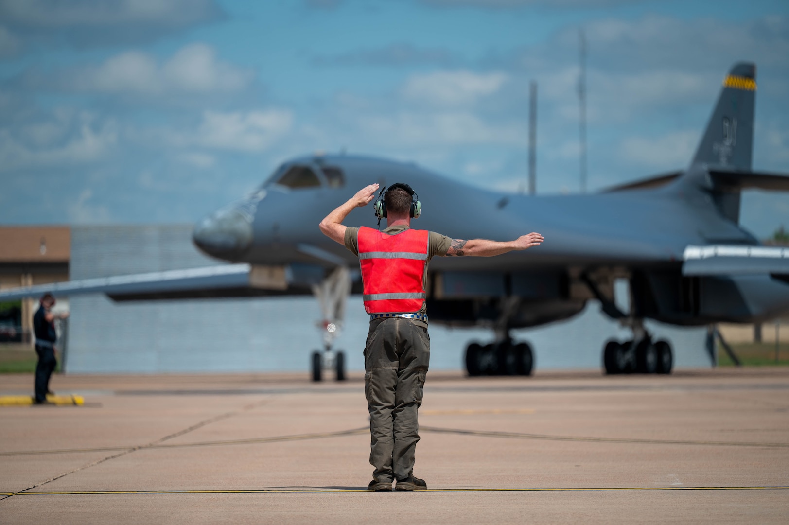 U.S. Air Force Airman 1st Class Trevor Francisco, 28th Bomber Generation Squadron assistant dedicated crew chief, taxis in a B-1B Lancer, tail number 86-0115, at Dyess Air Force Base, Texas, April 22, 2026. Francisco is part of the maintenance team responsible for keeping the newly regenerated bomber mission-ready after it was recalled from retirement to support the active bomber fleet and serve as the 7th Bomb Wing's historic "Apocalypse II" flagship. (U.S. Air Force photo by Airman 1st Class William Neal)