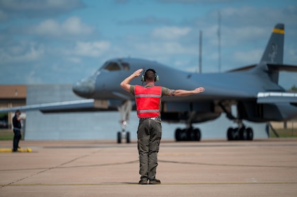 U.S. Air Force Airman 1st Class Trevor Francisco, 28th Bomber Generation Squadron assistant dedicated crew chief, taxis in a B-1B Lancer, tail number 86-0115, at Dyess Air Force Base, Texas, April 22, 2026. Francisco is part of the maintenance team responsible for keeping the newly regenerated bomber mission-ready after it was recalled from retirement to support the active bomber fleet and serve as the 7th Bomb Wing's historic "Apocalypse II" flagship. (U.S. Air Force photo by Airman 1st Class William Neal)