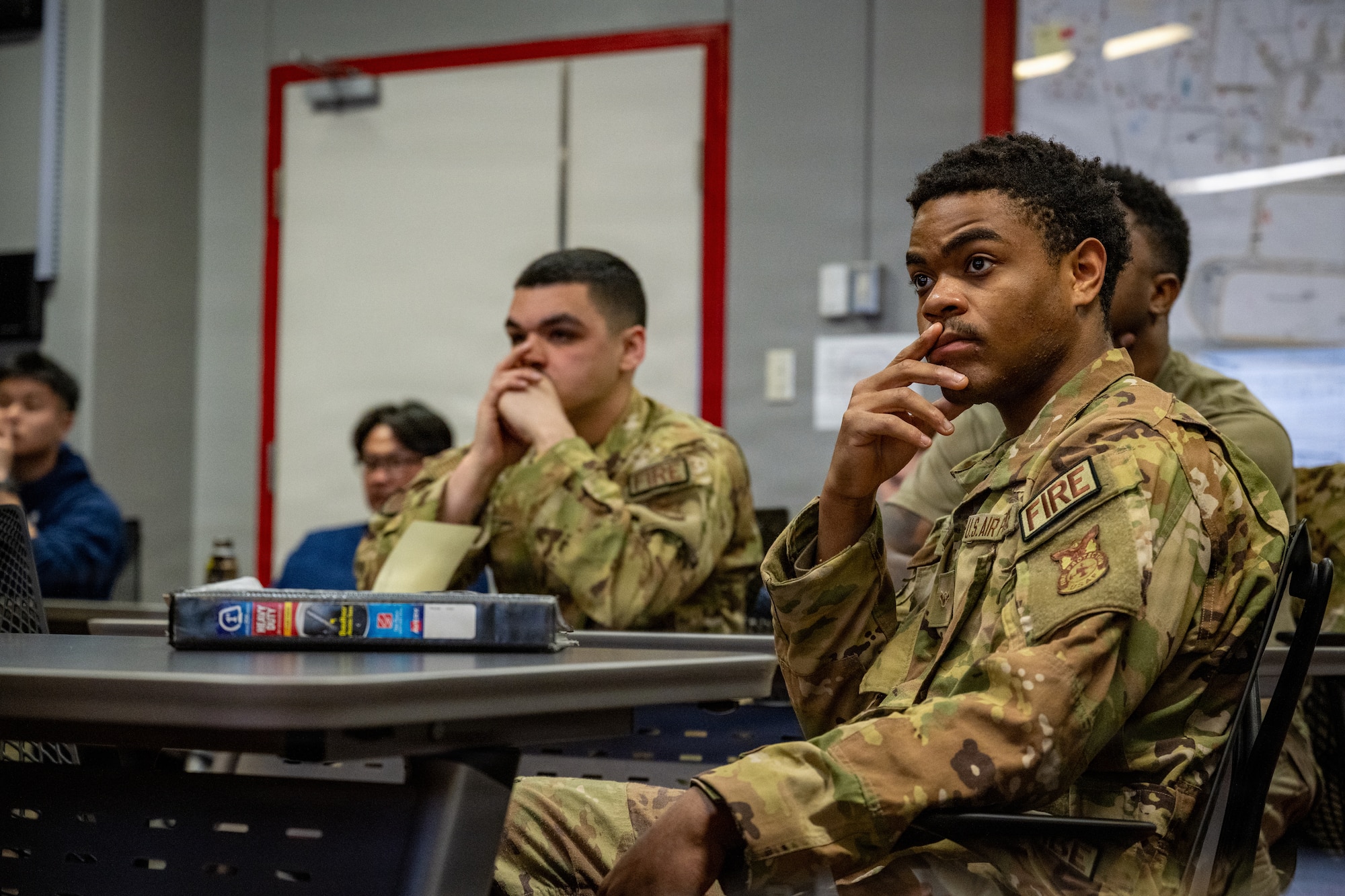 U.S. Air Force firefighters assigned to the 35th Civil Engineer Squadron attend a briefing on F-35 Lightning II hazard zones and emergency response procedures at Misawa Air Base, Japan, April 2, 2026.