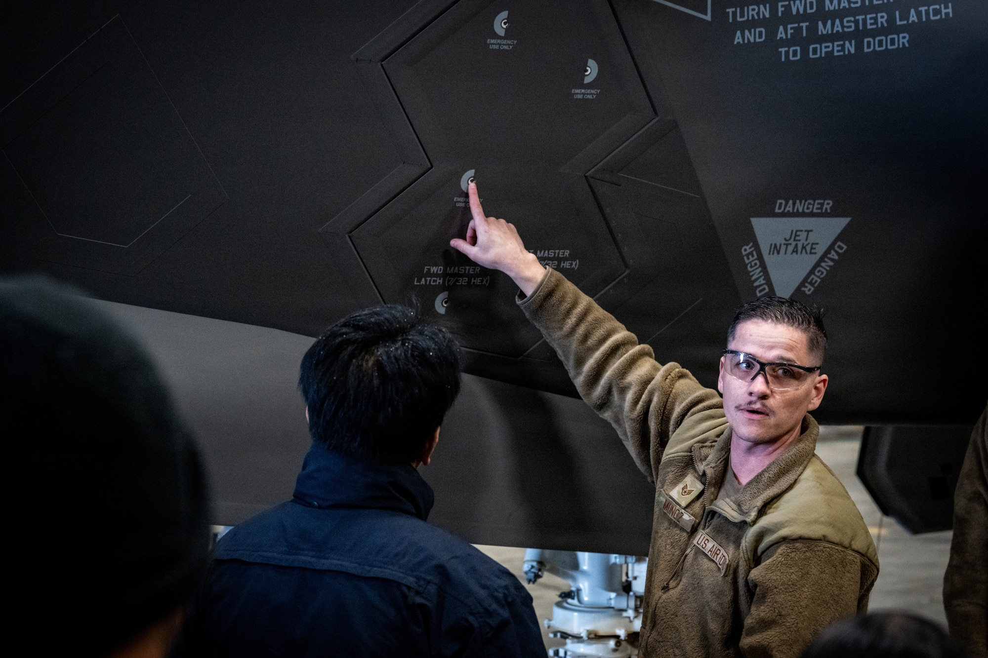 U.S. Air Force Staff Sgt. Matthew Muñoz, 13th Fighter Generation Squadron crew chief, showcases different parts of an F-35 Lightning II to 35th Civil Engineer Squadron firefighters at Misawa Air Base, Japan, April 2, 2026.