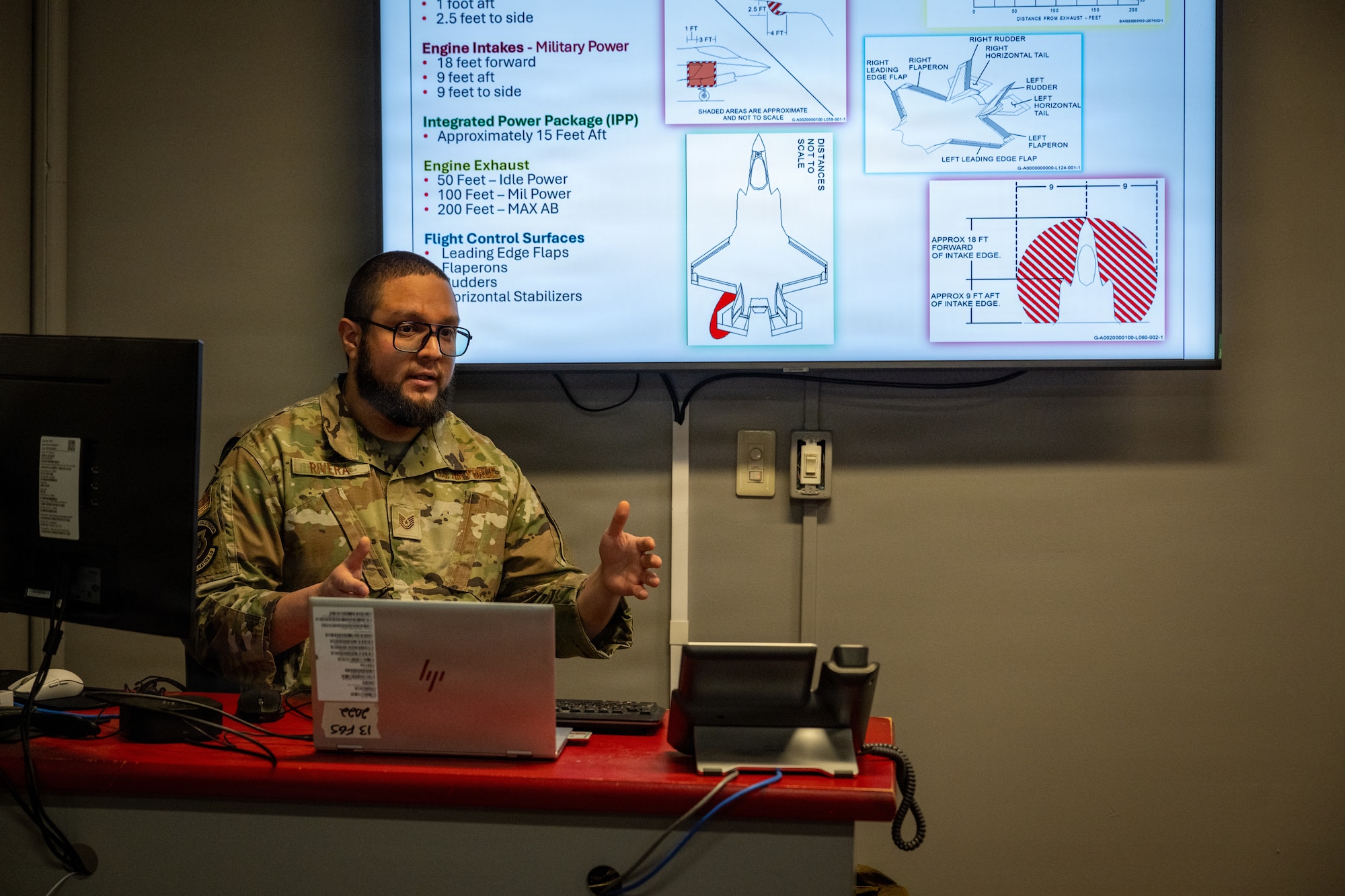 U.S. Air Force Tech. Sgt. Luis Rivera, 13th Fighter Generation Squadron crew chief, briefs firefighters assigned to the 35th Civil Engineer Squadron on F-35 Lightning II danger zones at Misawa Air Base, Japan, April 2, 2026.