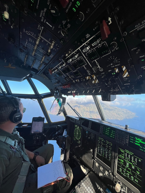U.S. Coast Guard Lt. j.g. Austin Catling, an HC-130 Hercules airplane pilot assigned to Coast Guard Air Station Barbers Point in Kapolei, Hawaii, surveys the island of Agrihan in the Commonwealth of the Northern Mariana Islands April 27, 2026. During their search for the missing crew members of the capsized cargo vessel Mariana, Coast Guard aircrews conducted aerial searches of other Northern Mariana Islands, including Pagan, Alamagan, Asuncion and the Maug Islands. (U.S. Coast Guard photo, courtesy Air Station Barbers Point)