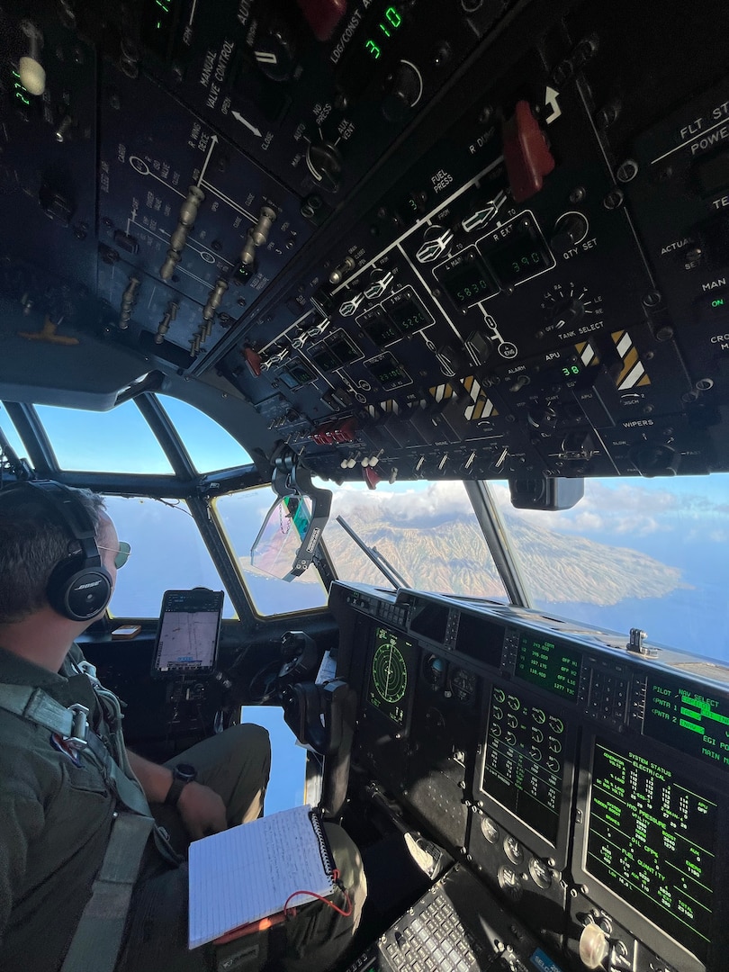 U.S. Coast Guard Lt. j.g. Austin Catling, an HC-130 Hercules airplane pilot assigned to Coast Guard Air Station Barbers Point in Kapolei, Hawaii, surveys the island of Agrihan in the Commonwealth of the Northern Mariana Islands April 27, 2026. During their search for the missing crew members of the capsized cargo vessel Mariana, Coast Guard aircrews conducted aerial searches of other Northern Mariana Islands, including Pagan, Alamagan, Asuncion and the Maug Islands. (U.S. Coast Guard photo, courtesy Air Station Barbers Point)