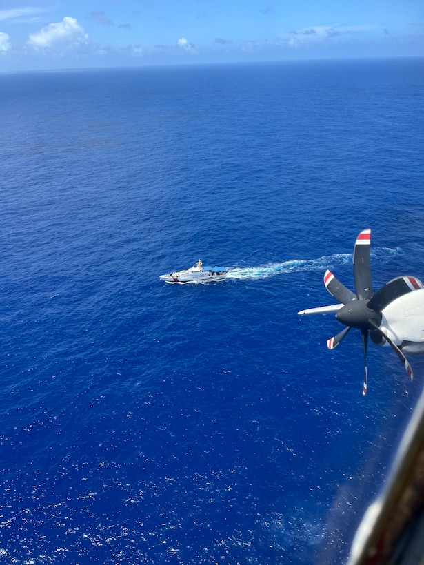 An HC-130 Hercules airplane crew assigned to U.S. Coast Guard Air Station Barbers Point in Kapolei, Hawaii, flies over fast response cutter USCGC Oliver Henry (WPC 1140) while conducting searches in the vicinity of the Commonwealth of the Northern Mariana Islands April 27, 2026. Coast Guard crews and partners searched for five missing crew members from the 145-foot cargo vessel Mariana, which crews located overturned about 34 nautical miles northeast of Pagan on April 17. (U.S. Coast Guard photo, courtesy Air Station Barbers Point)