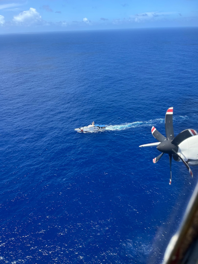 An HC-130 Hercules airplane crew assigned to U.S. Coast Guard Air Station Barbers Point in Kapolei, Hawaii, flies over fast response cutter USCGC Oliver Henry (WPC 1140) while conducting searches in the vicinity of the Commonwealth of the Northern Mariana Islands April 27, 2026. Coast Guard crews and partners searched for five missing crew members from the 145-foot cargo vessel Mariana, which crews located overturned about 34 nautical miles northeast of Pagan on April 17. (U.S. Coast Guard photo, courtesy Air Station Barbers Point)