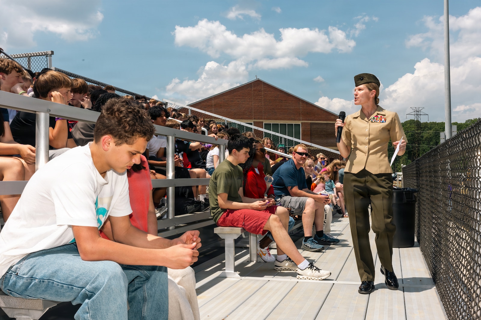 U.S. Marine Corps Col. Jenny Colegate, the commanding officer of Marine Corps Base Quantico, addresses students during a rally at Quantico Middle/High School on MCB Quantico, Virginia, April 24, 2026. The rally recognized students for their academic efforts while also honoring the large portion of the student body with military connections by commemorating the Month of the Military Child. (U.S. Marine Corps photo by Cpl. Darien Wright)