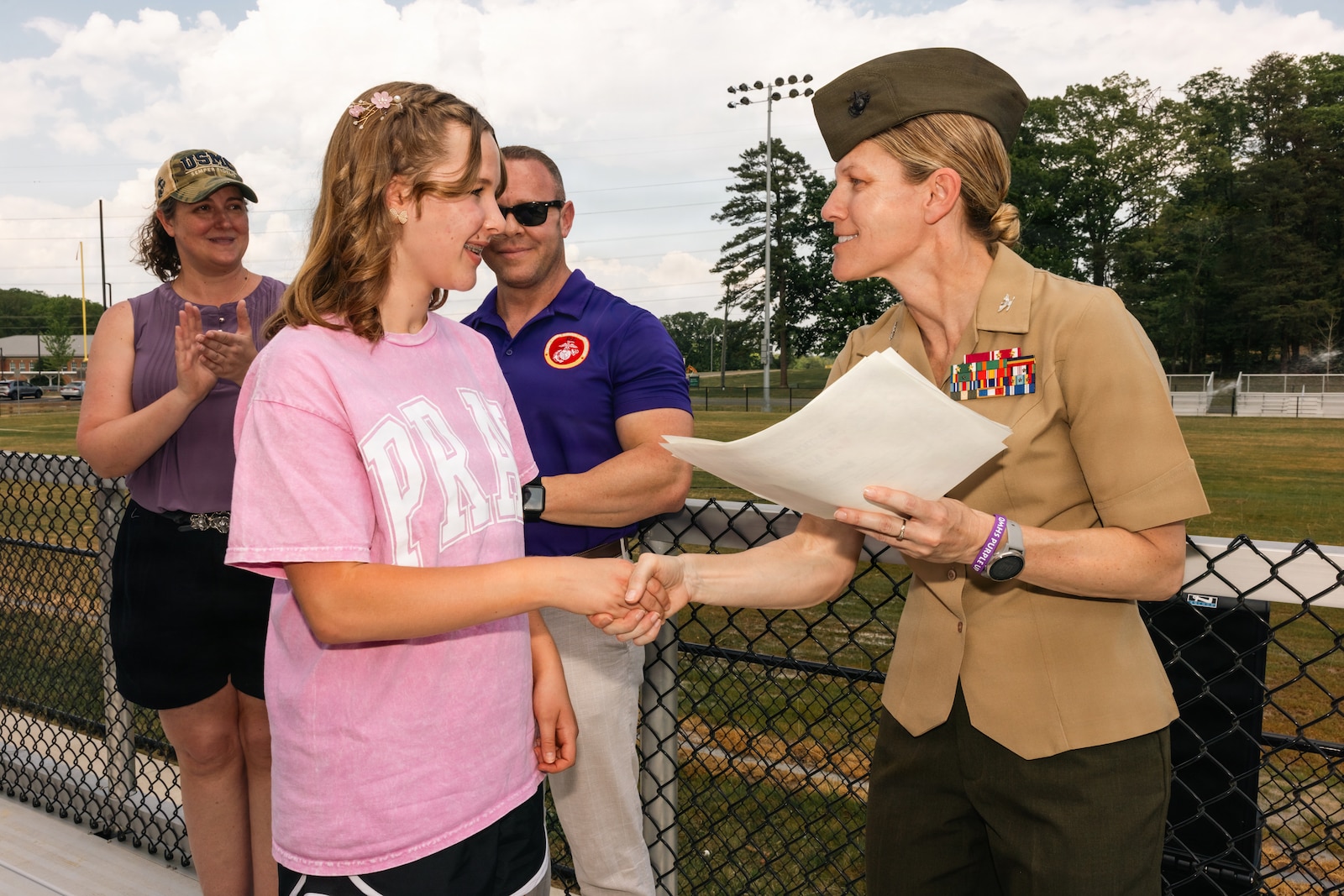U.S. Marine Corps Col. Jenny Colegate, right, the commanding officer of Marine Corps Base Quantico, shakes hands with a student during a rally at Quantico Middle/High School on MCB Quantico, Virginia, April 24, 2026. The rally recognized students for their academic efforts while also honoring the large portion of the student body with military connections by commemorating the Month of the Military Child. (U.S. Marine Corps photo by Cpl. Darien Wright)