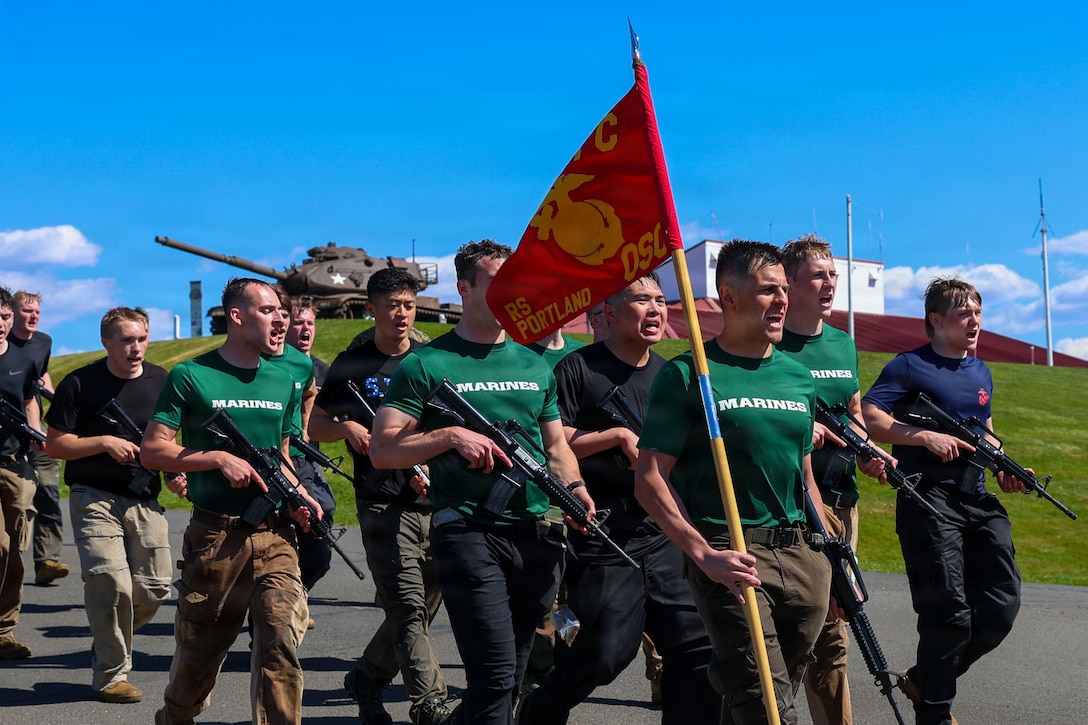 U.S. Marine Corps officer candidates participate in a hike during a Mini-Officer Candidate School event at Camp Rilea Armed Forces Training Center in Warrenton, Oregon, April 25, 2026. Mini-OCS provides applicants and candidates a glimpse into Officer Candidate School by placing them through an intense training environment designed to test their endurance, resiliency, and courage. (U.S. Marine Corps photo by Lance Cpl. Monserrath Mora)