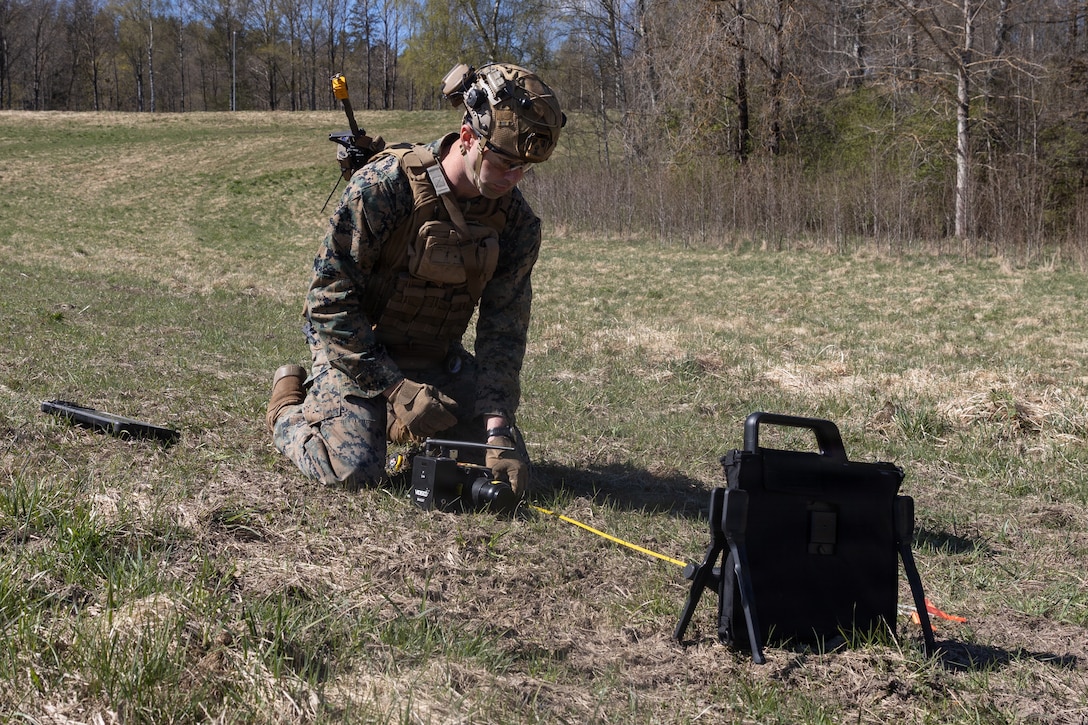 U.S. Marine Corps Staff Sgt. Seth Compton, an explosive ordnance disposal technician with Combat Logistics Battalion 24, Combat Logistics Regiment 27, 2nd Marine Logistics Group, sets up an X-ray device during exercise Aurora 26 in Kvarn, Sweden, April 26, 2026. EOD Marines hone their skills and safety procedures for the handling and disposal of ordnance in every environment. U.S. Marines and Sailors with 2nd MLG are participating in exercise Aurora as part of the larger U.S. Army-led Sword 26 series of linked multinational exercises, which directly supports NATO's Eastern Flank Deterrence Initiative concept, validates defense plans, builds a unified lethal force, and strengthens deterrence. Compton is a native of Tennessee. (U.S. Marine Corps photo by Lance Cpl. Talan Werner)