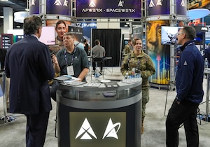 Allen Franke and First Lt. Sarah Milian, AFWERX program managers, brief attendees during the Warfare Symposium at the Gaylord Rockies Resort and Convention Center in Aurora, Colorado, Feb. 24, 2026.