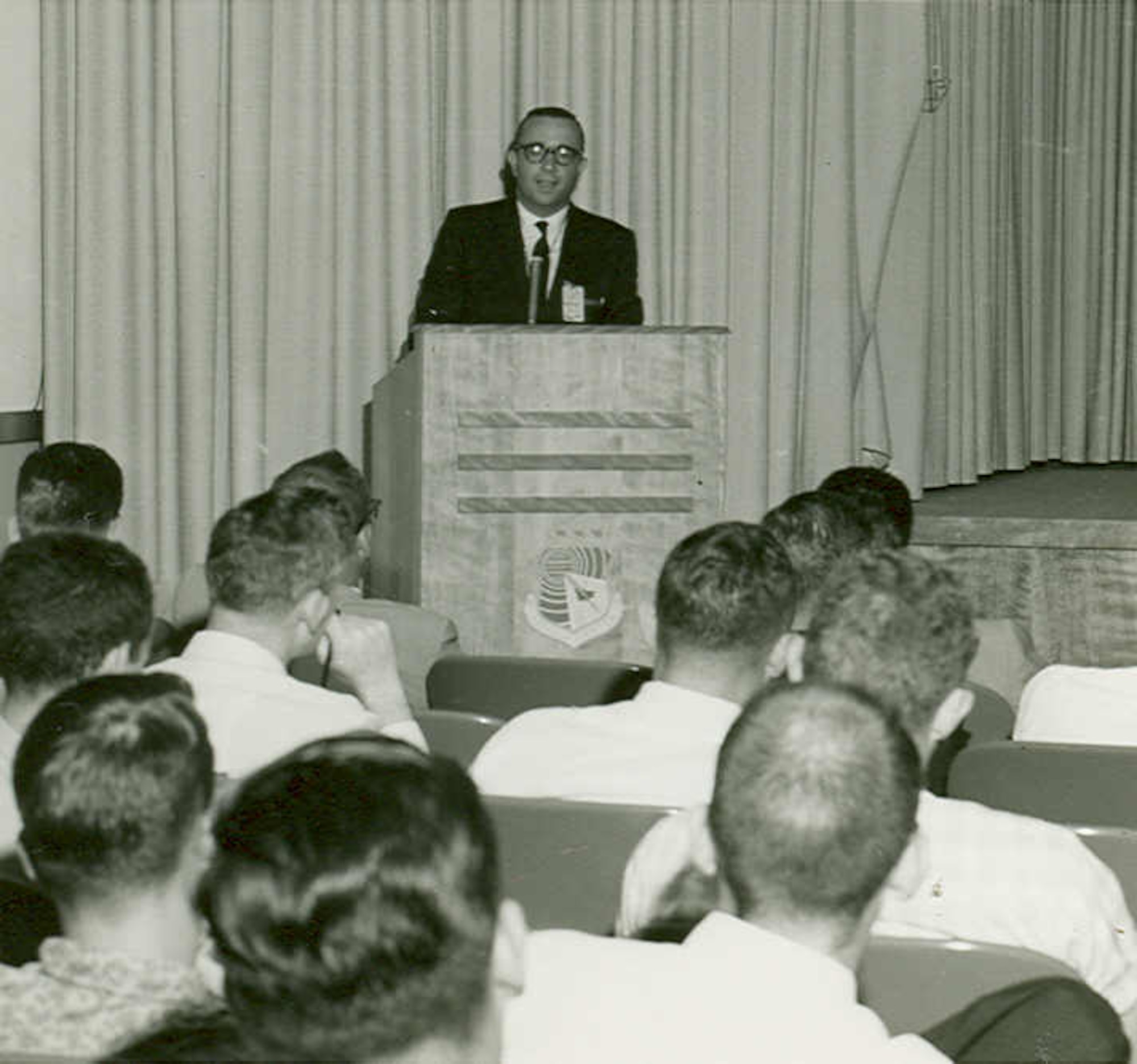 S.S. Penner, professor of jet propulsion at the California Institute of Technology, presents a lecture in 1961 to a group of graduate students at Arnold Engineering Development Center. The lecture was sponsored by Arnold Research Organization Inc., the first company awarded a contract to maintain and operate AEDC, in conjunction with the University of Tennessee graduate school. After being the subject of a study in the early 1950s, a program through which the University of Tennessee would award graduate degrees to engineers at AEDC was approved in mid-1956. (U.S. Air Force photo)