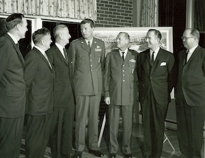 Gen. Bernard Schriever, commander of the Air Force Systems Command, center, speaks with other attendees of a 1963 dinner at Arnold Engineering Development Center during which the University of Tennessee Space Institute was discussed. The first UTSI classes were held Sept. 24, 1964, at AEDC in offices provided by the Air Force as UTSI was constructed. In the years leading up to the establishment of UTSI, a program was in place through which the University of Tennessee would award graduate degrees to engineers at AEDC. Pictured with Schriever, from left, are former State Sen. Ewing Threet, Arnold Research Organization Director of Engineering Bernhard Goethert, University of Tennessee President Andrew Holt, AEDC Commander Maj. Gen. William L. Rogers, Tennessee Lt. Gov. James Bomar and University of Tennessee Graduate Schools Dean A.A. Smith. (U.S. Air Force photo)