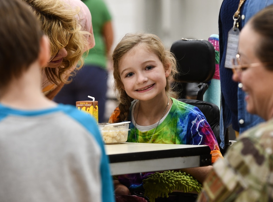 Hannah flashes a smile during lunchtime at Leonard Lawrence Elementary school in Bellevue, Neb. on April 22, 2026. (U.S. Air Force photo by Chad Watkins)