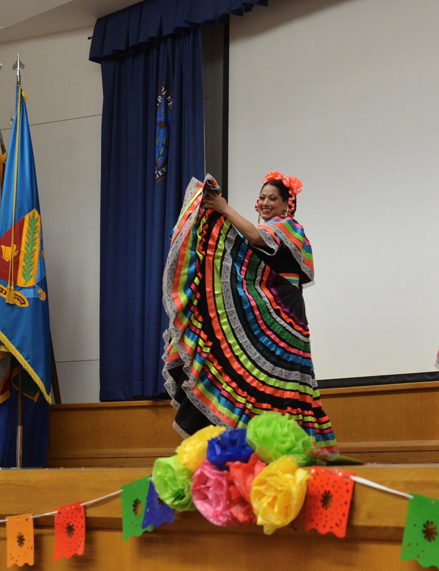 A dancer from Danzantes de San Antonio demonstrates heritage through dance at the Fiesta Showcase at the Defense Language Institute English Language Center in San Antonio, Texas, April 15, 2026. DLIELC is known as the “Gateway to America.” DLIELC builds security cooperation through English language training and cultural immersion for international military partners and pre-basic combat trainees in the U.S. Army and Coast Guard. (U.S. Air Force photo by Agnes Koterba)