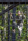 Pvt. 1st Class Zhiyi Wang, 18th Finance Battalion Bravo Company cashier, completes an obstacle course on Fort Jackson, S.C., April 20, 2026. Twelve finance and comptroller Soldiers took part in the obstacle course on the first day of the U.S. Army Finance Corps’ annual Finance Soldier of the Year competition. (U.S. Army photo by 1st Lt. Maria Rozo)