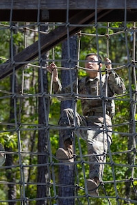 Pvt. 1st Class Zhiyi Wang, 18th Finance Battalion Bravo Company cashier, completes an obstacle course on Fort Jackson, S.C., April 20, 2026. Twelve finance and comptroller Soldiers took part in the obstacle course on the first day of the U.S. Army Finance Corps’ annual Finance Soldier of the Year competition. (U.S. Army photo by 1st Lt. Maria Rozo)