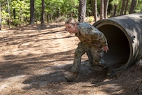 Sgt. Tina Martinez, 106th Finance Battalion Alpha Company training noncommissioned officer in charge, completes an obstacle course on Fort Jackson, S.C., April 20, 2026. Twelve finance and comptroller SoldierVs took part in the obstacle course on the first day of the U.S. Army Finance Corps’ annual Finance Soldier of the Year competition. (U.S. Army photo by Mark R. W. Orders-Woempner)