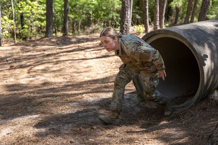 Sgt. Tina Martinez, 106th Finance Battalion Alpha Company training noncommissioned officer in charge, completes an obstacle course on Fort Jackson, S.C., April 20, 2026. Twelve finance and comptroller SoldierVs took part in the obstacle course on the first day of the U.S. Army Finance Corps’ annual Finance Soldier of the Year competition. (U.S. Army photo by Mark R. W. Orders-Woempner)