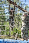 Spc. Erick Bedoya, 15th Finance Battalion financial management technician, completes an obstacle course on Fort Jackson, S.C., April 20, 2026. Twelve finance and comptroller Soldiers took part in the obstacle course on the first day of the U.S. Army Finance Corps’ annual Finance Soldier of the Year competition. (U.S. Army photo by 1st Lt. Maria Rozo)