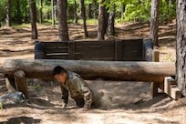 Pvt. 1st Class Zhiyi Wang, 18th Finance Battalion Bravo Company cashier, completes an obstacle course on Fort Jackson, S.C., April 20, 2026. Twelve finance and comptroller Soldiers took part in the obstacle course on the first day of the U.S. Army Finance Corps’ annual Finance Soldier of the Year competition. (U.S. Army photo by Mark R. W. Orders-Woempner)