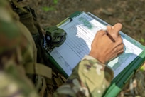 Capt. Bethani Glover-Greaves, 18th Finance Battalion Alpha Company commander, takes part in a land navigation exercise at the Mekong Delta day land navigation course on Fort Jackson, S.C., April 20, 2026. Twelve finance and comptroller Soldiers took part in the land navigation course on the first day of the U.S. Army Finance Corps’ annual Finance Soldier of the Year competition. (U.S. Army photo by Mark R. W. Orders-Woempner)